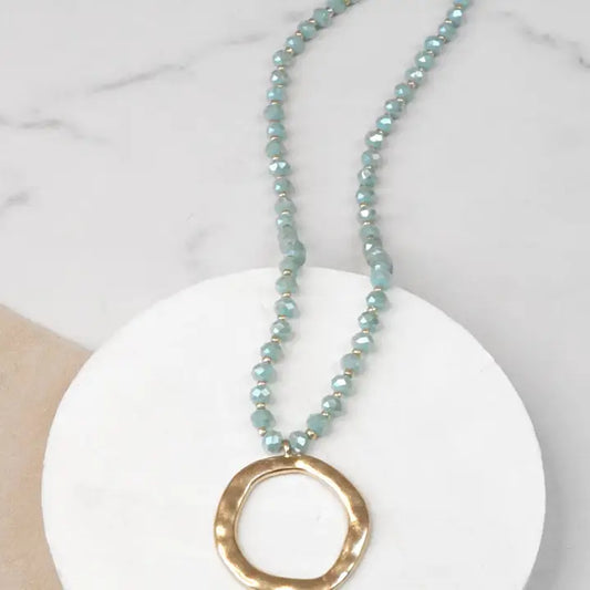 Beaded Necklace with Gold Tone Circle Pendant Aqua